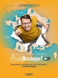 Couverture de À toute Berzingue ! de Lorànt Deutsch sur fond jaune orangé. L’auteur apparaît en illustration photographique, semblant traverser une carte de France déchirée, le poing tendu vers l’avant dans une posture dynamique. Plusieurs grandes villes 