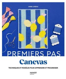 Couverture du livre "Premiers pas en canevas : Techniques et modèles pour apprendre et progresser" par Anne Loiseau aux éditions Mango. Le visuel, sur un fond bleu roi, met en avant un canevas brodé de citrons jaunes sur des rayures bleues, joliment entou