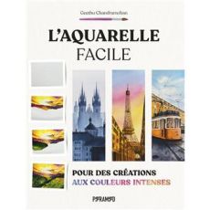 Couverture du livre L'aquarelle facile par Geethu Chandramohan. Illustrations de paysages montagneux, de la tour Eiffel et d'un tramway aux couleurs intenses et lumineuses.