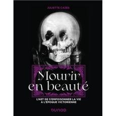 Couverture noire du livre Mourir en beauté de Juliette Cazes, aux éditions Dunod, représentant un crâne humain en noir et blanc sur lequel apparaissent deux personnages féminins en robes victoriennes. Le titre est inscrit en grandes lettres blanches sur u