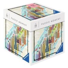 Boîte du puzzle Ravensburger Puzzle Moment 99 pièces New York représentant une carte stylisée de Manhattan avec bâtiments colorés, vue en perspective sur fond clair.